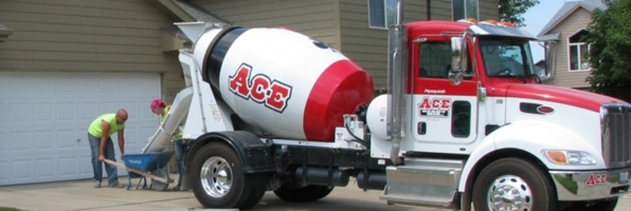 Small cement truck in driveway